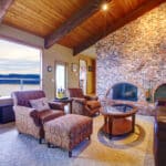 Beautiful rustic livingroom with fireplace and wood ceiling - Sprint Funding