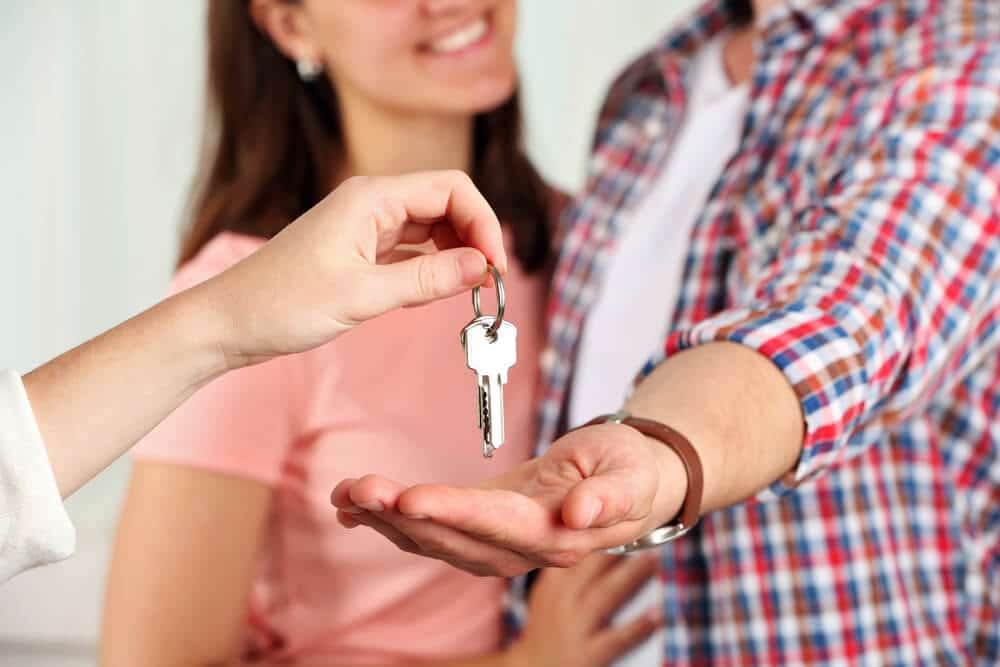 Real estate agent giving keys - Sprint Funding