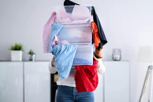 Woman Decluttering and Doing Laundry - Sprint Funding