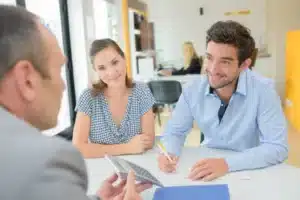 A couple talking to a loan officer