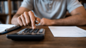 man using a calculator